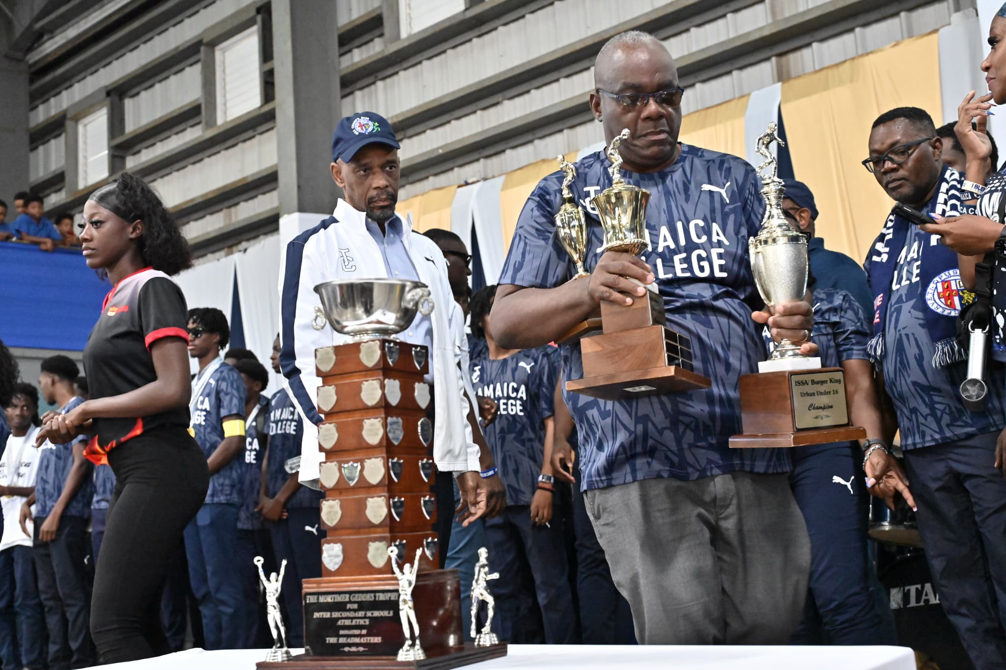 Celebrating the Champs Victory with trophies on display